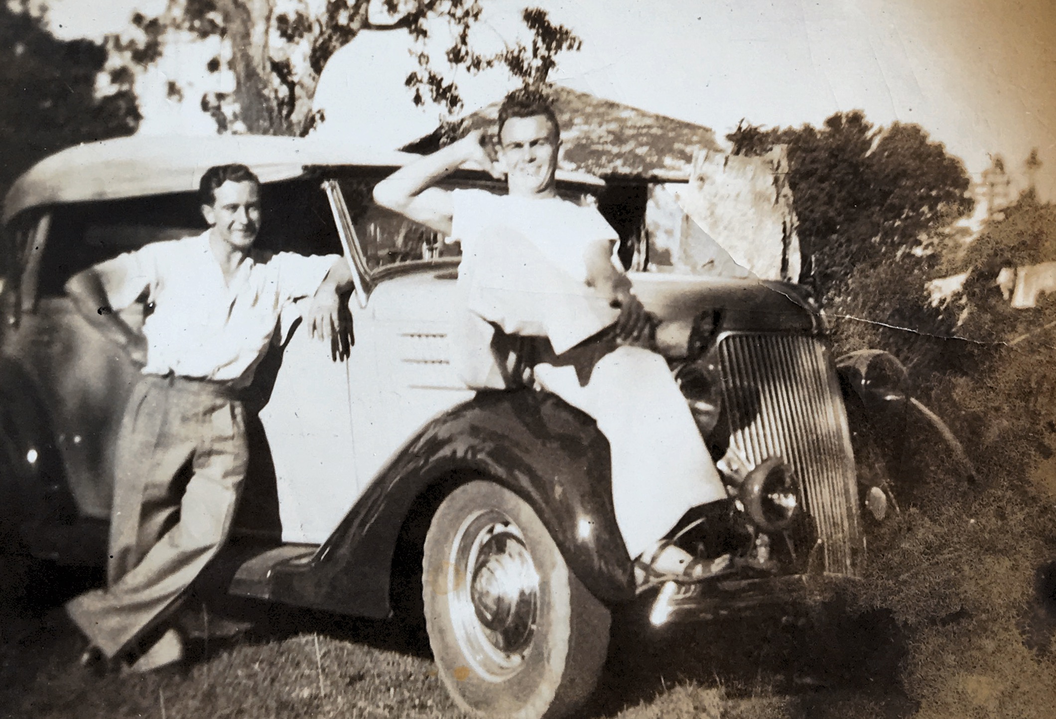 Ray and Sid Price clowning around with Ray’s Ford. Circa 1946