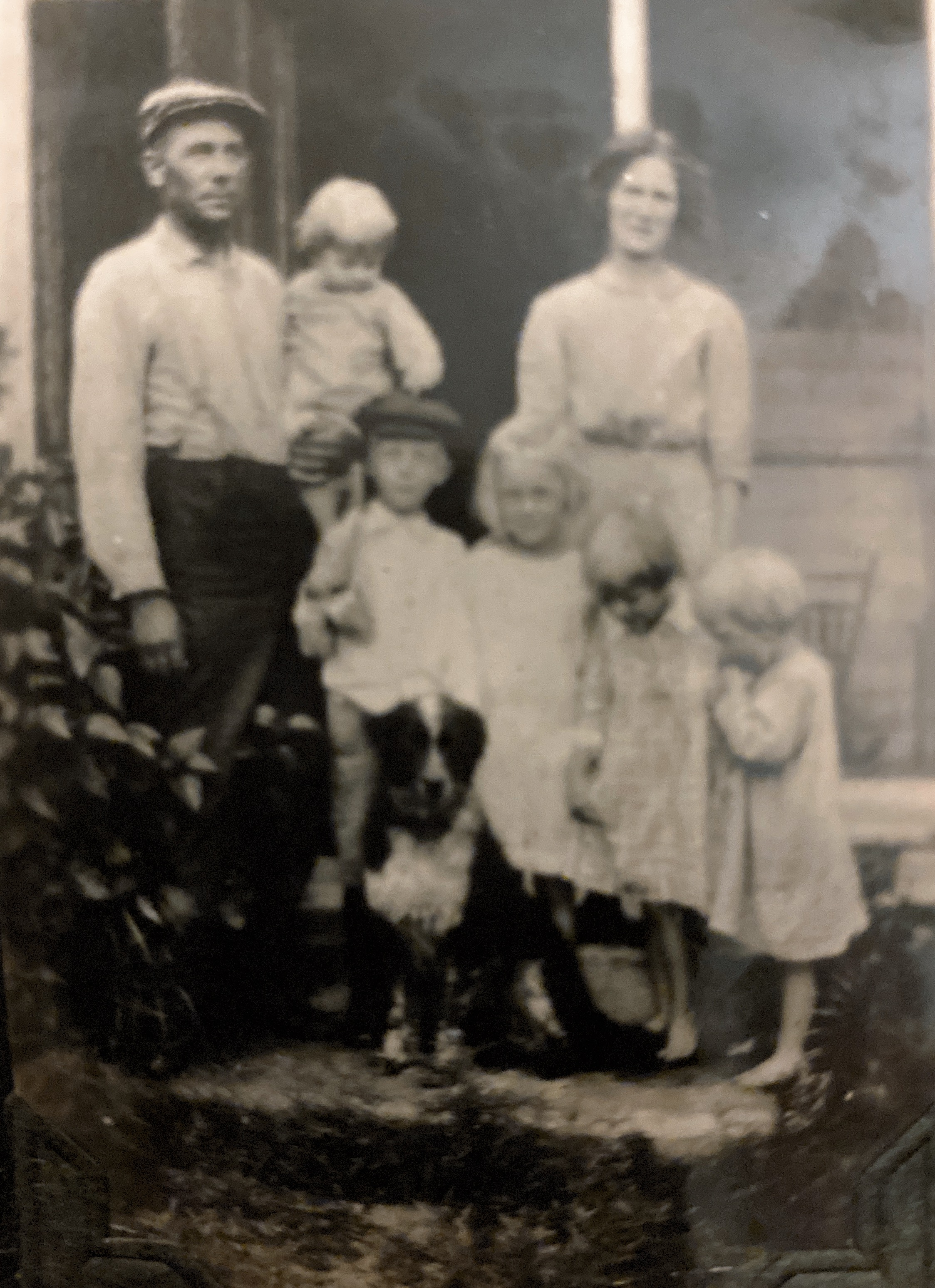 Martin Matthew Tousgaard, Sophia Wilhelmina Bohnert Tousgaard and the “Tousgaard stairsteps”, their children: Carol Marie, the youngest at about 18 mos., in her father’s arms, Gerald Martin aged , Vee Esther aged , Elsie Marian aged , and Dorothy Barbara aged 3.5. 