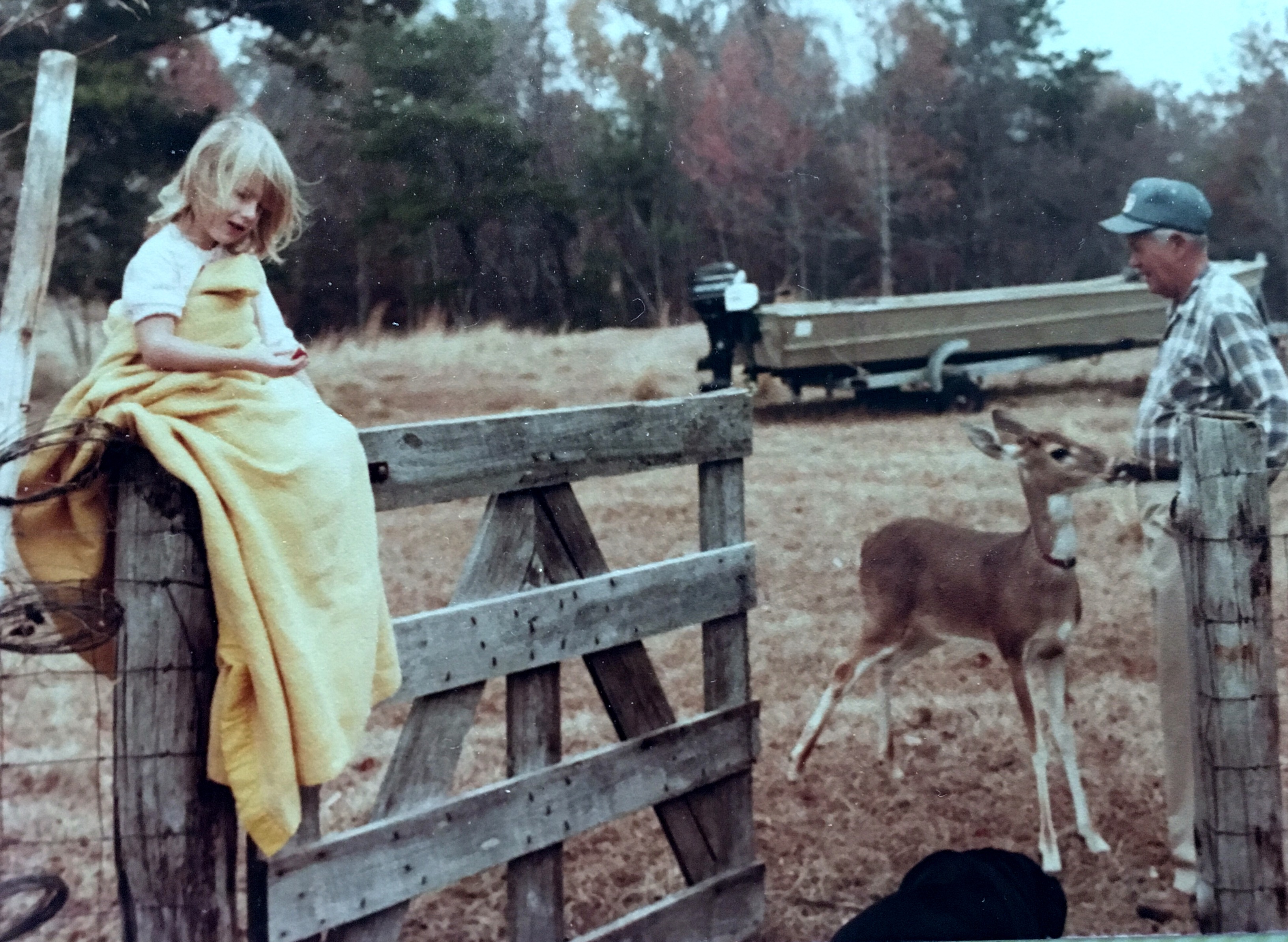 Fall season reminds me of Daddy.  This picture was taken about 1980 with Daddy feeding Bucky while granddaughter, Kelly, is snuggled up on the fence post. This picture says so many things to me, but mostly love.