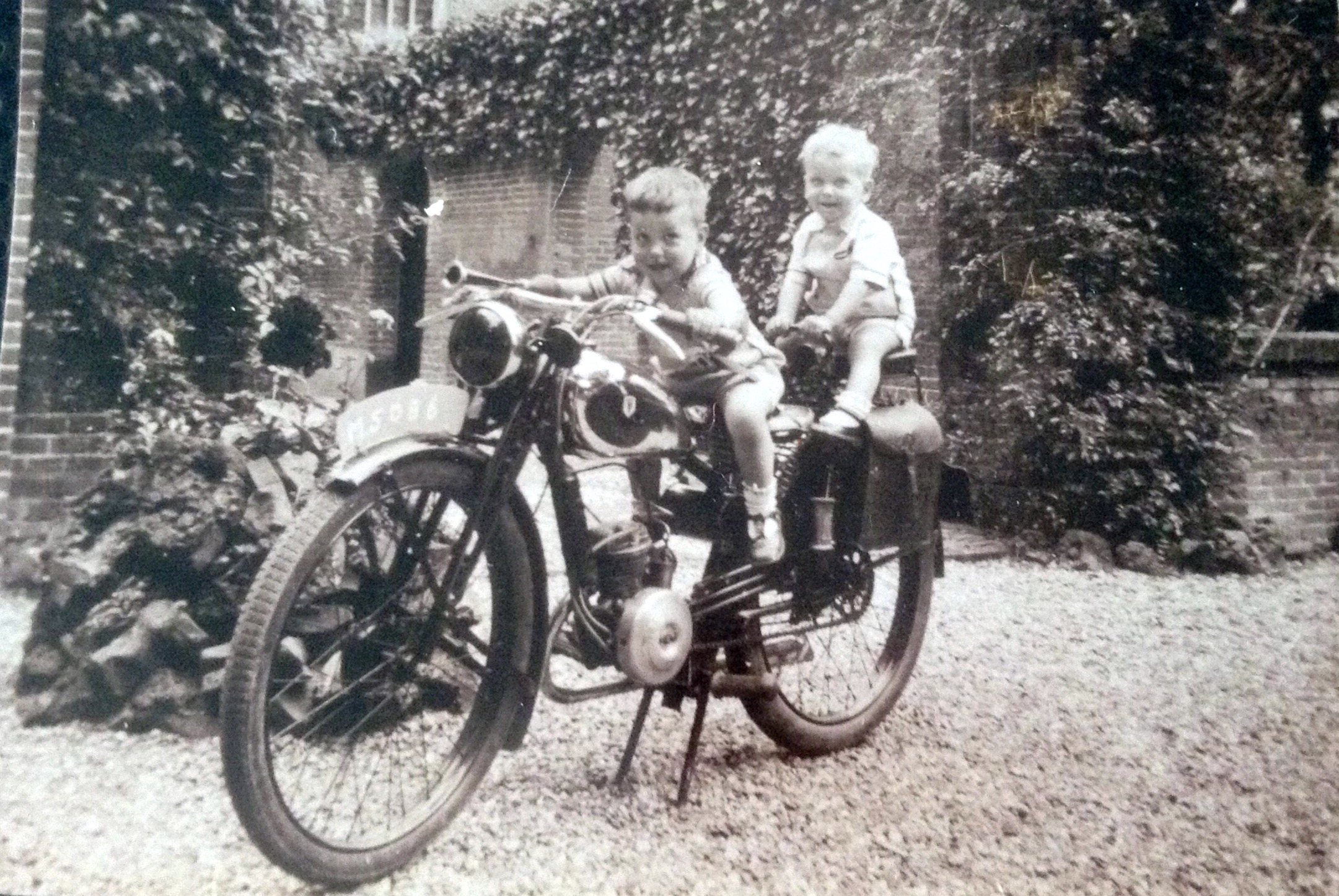 Me and my big brother on dad's motorbike in 1943, Netherlands