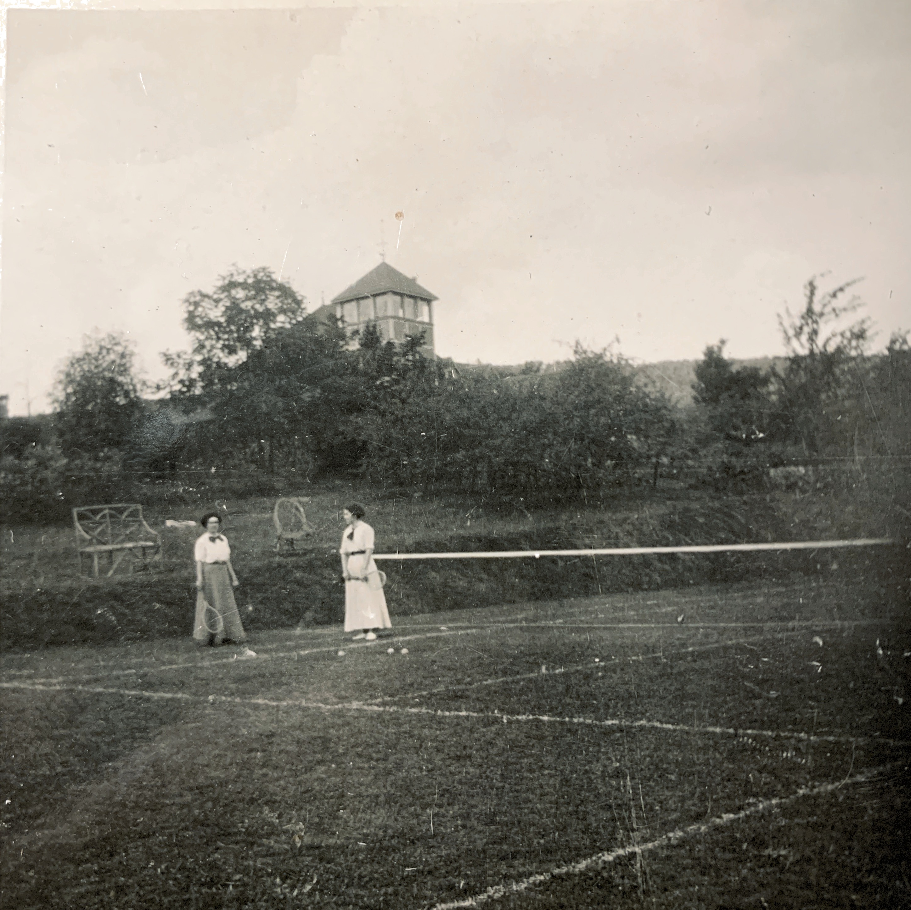 Photo: Butterworth tennis court, pre 1924. Ethel & Grace Butterworth were sisters. 

In 1919, Mr. Butterworth purchased two additional acres which abutted his property to the East from Francis Nelson, an Ottawa civil servant. The purpose of this purchase was to preserve the view down to the Ottawa River Valley. Included in this purchase was an additional 20 foot 