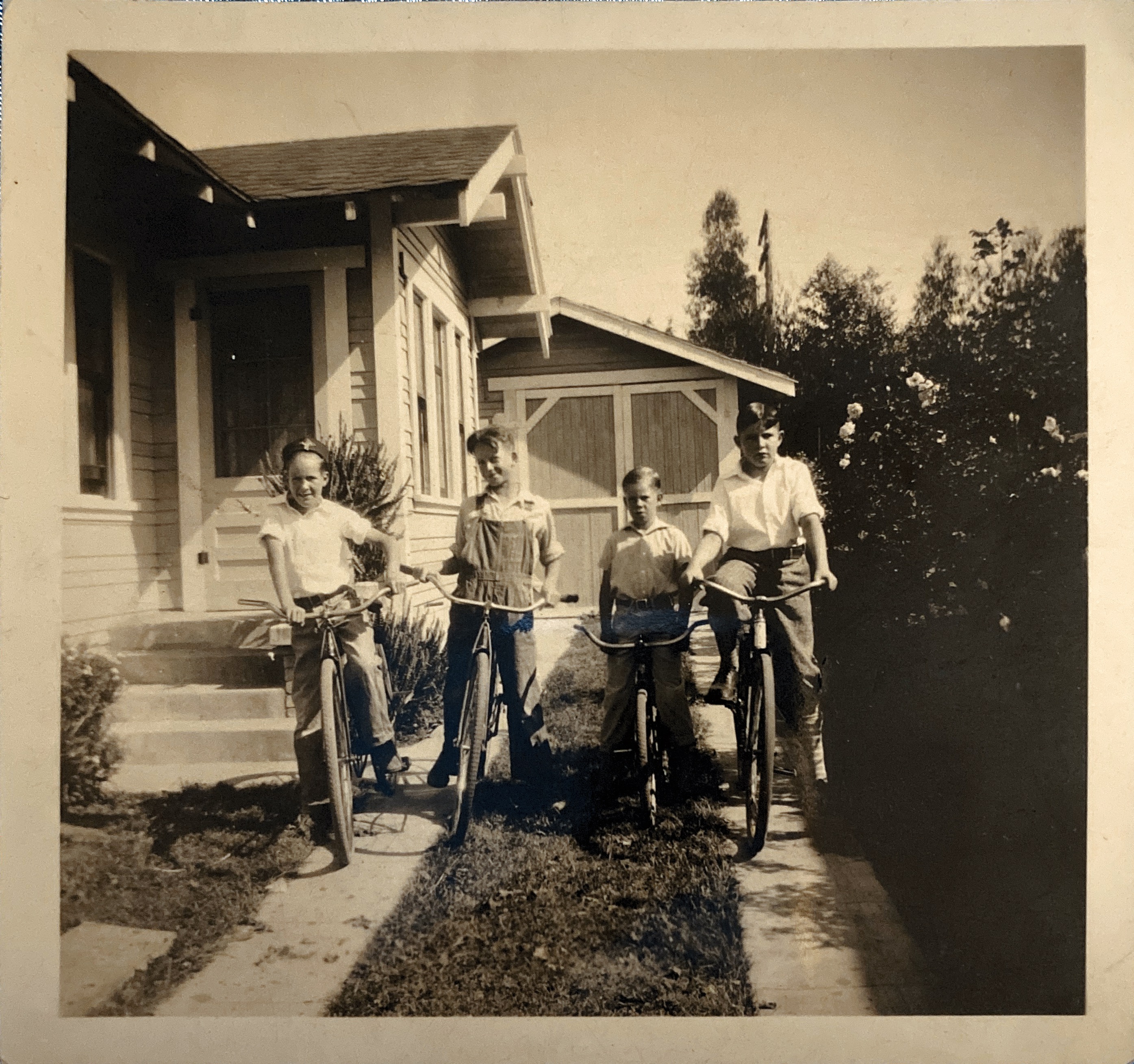 Ward White and his buddies ready to ride. 
In the driveway of his house in Pomona
Probably about 1930
Ward is on the right