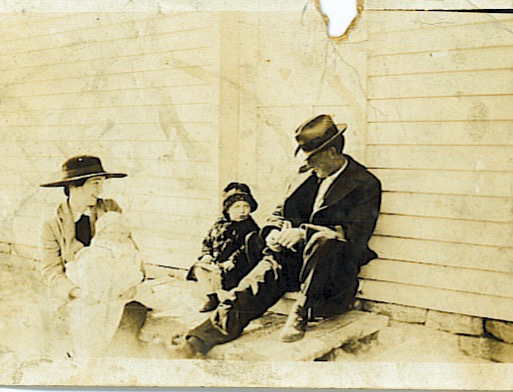 Married in August 1914, James L. Snider is seen here with his wife, Edith, who is holding their 2nd child, Nick. Nicholas was born in February 1917 and appears to be less than 1 year old here, dating the photo to about 1917, a time period one year prior to the Spanish Flu epidemic and a year or so from the end of WWI. Their eldest child William, born July 1915, is sitting beside James. The Sniders first lived in Washington County, Ky. but later moved to Nelson County. Nicholas was my maternal grandfather. He told me that he remembers moving their cattle to the new farm in Nelson County, Ky., making the trip on foot down Lick Skillet Rd. in Washington Co., traveling with the cattle for 17 miles. If they walked at 2mph, it would have taken tbem over 8 hours. Impressive!