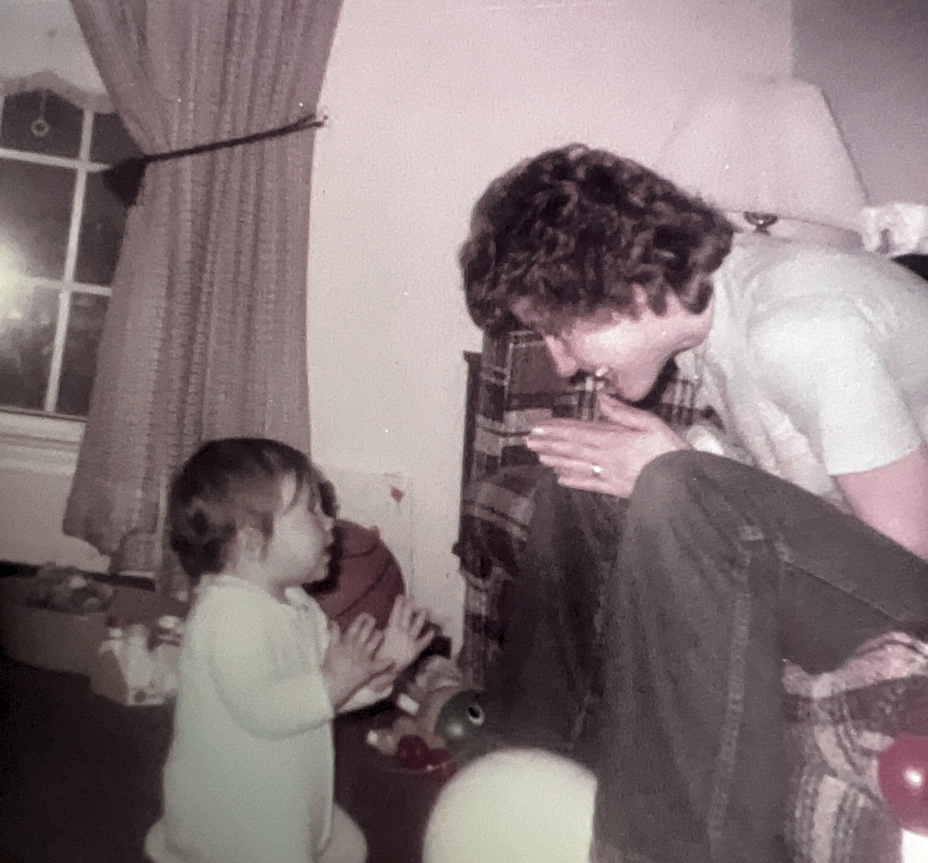 MJ and Stephanie playing Patey cake. March 1983