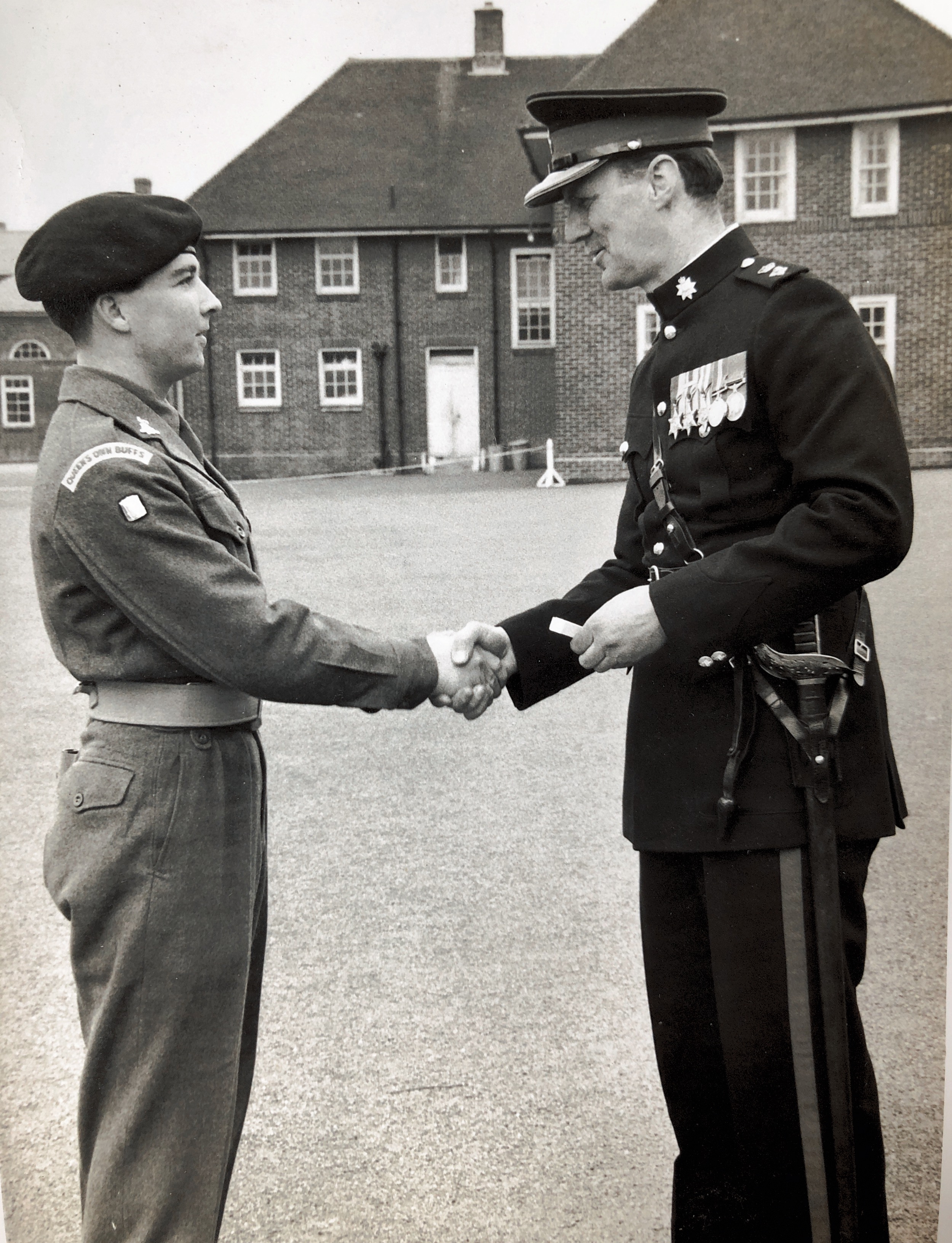 Lt Colonel PEC Andrews congratulating the top recruit at Wemyss Barracks in Canterbury in 1961