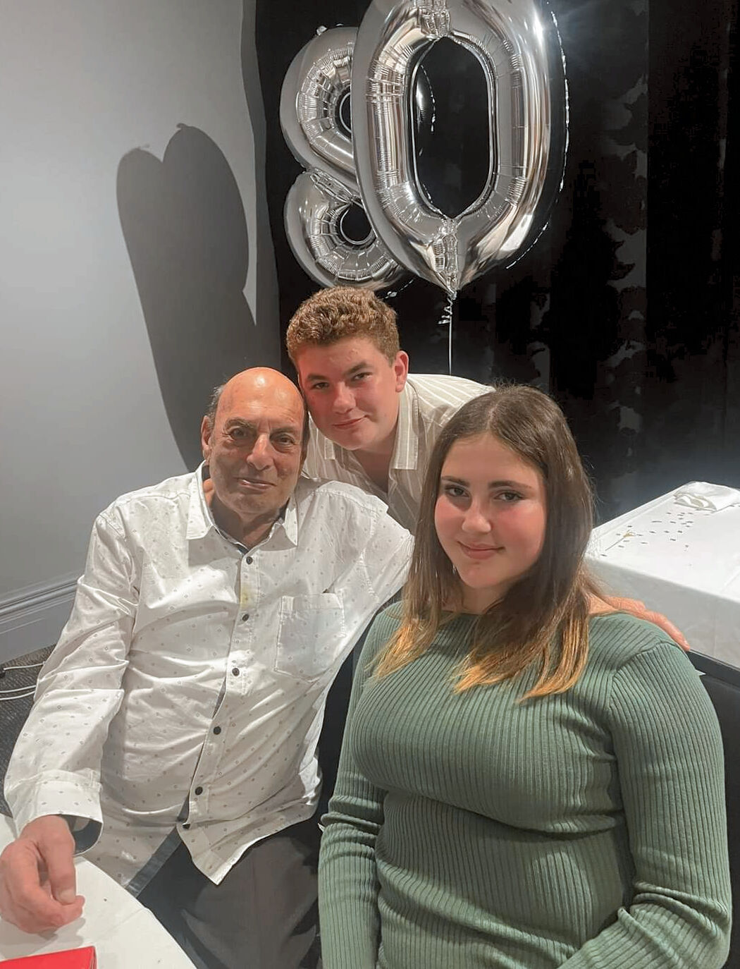 Papa Weinstein with Ella and Asher at Papa's 80th Birthday Dinner on 20th August 2022.