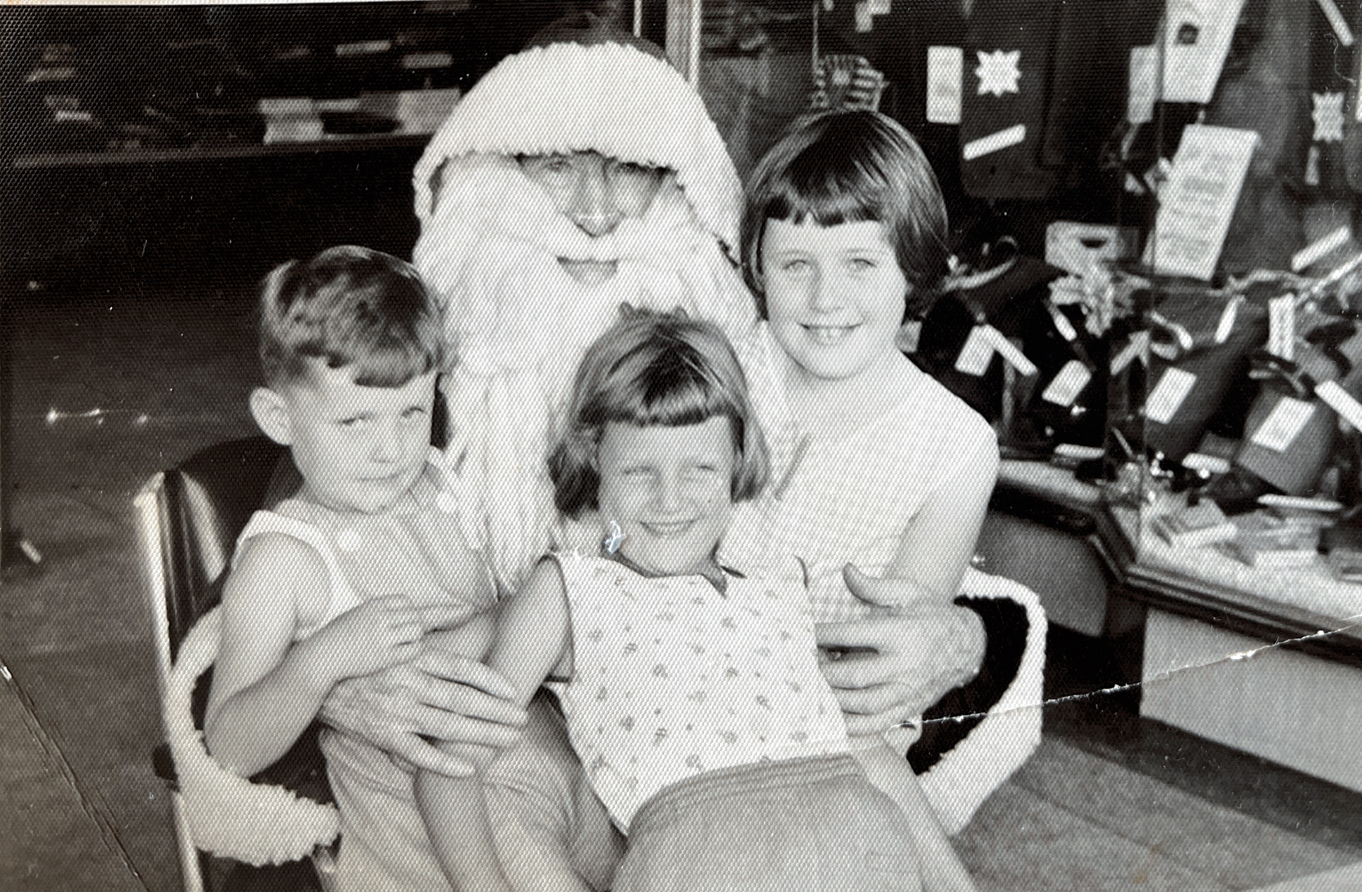 Sharon, Sandie and Ronnie with Santa about 1957