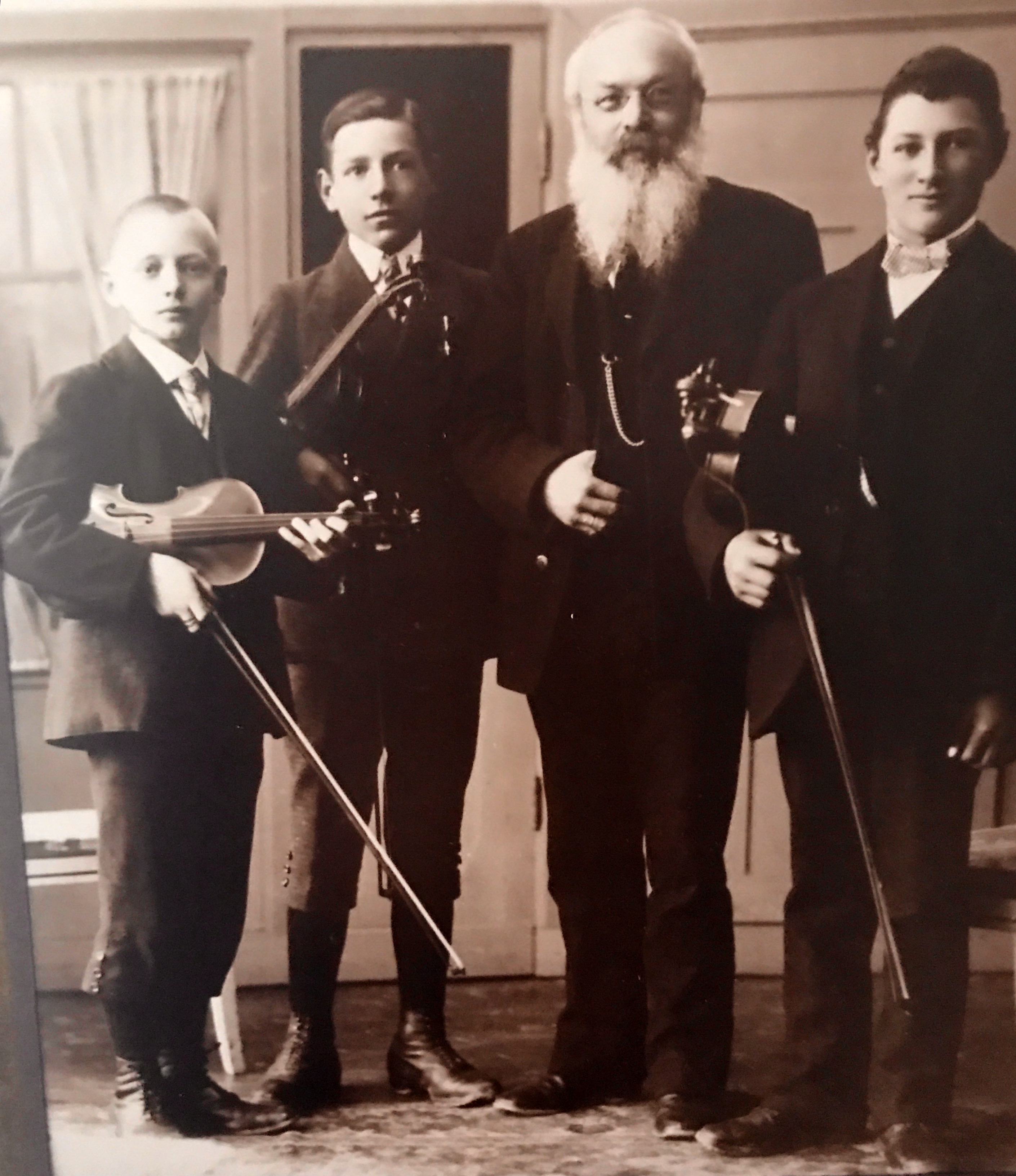 My Dad, Alexander Schafroth, 2nd from the left, 13 years old with his music teacher, and Two if his fellow students in Immenstadt, Germany 1913