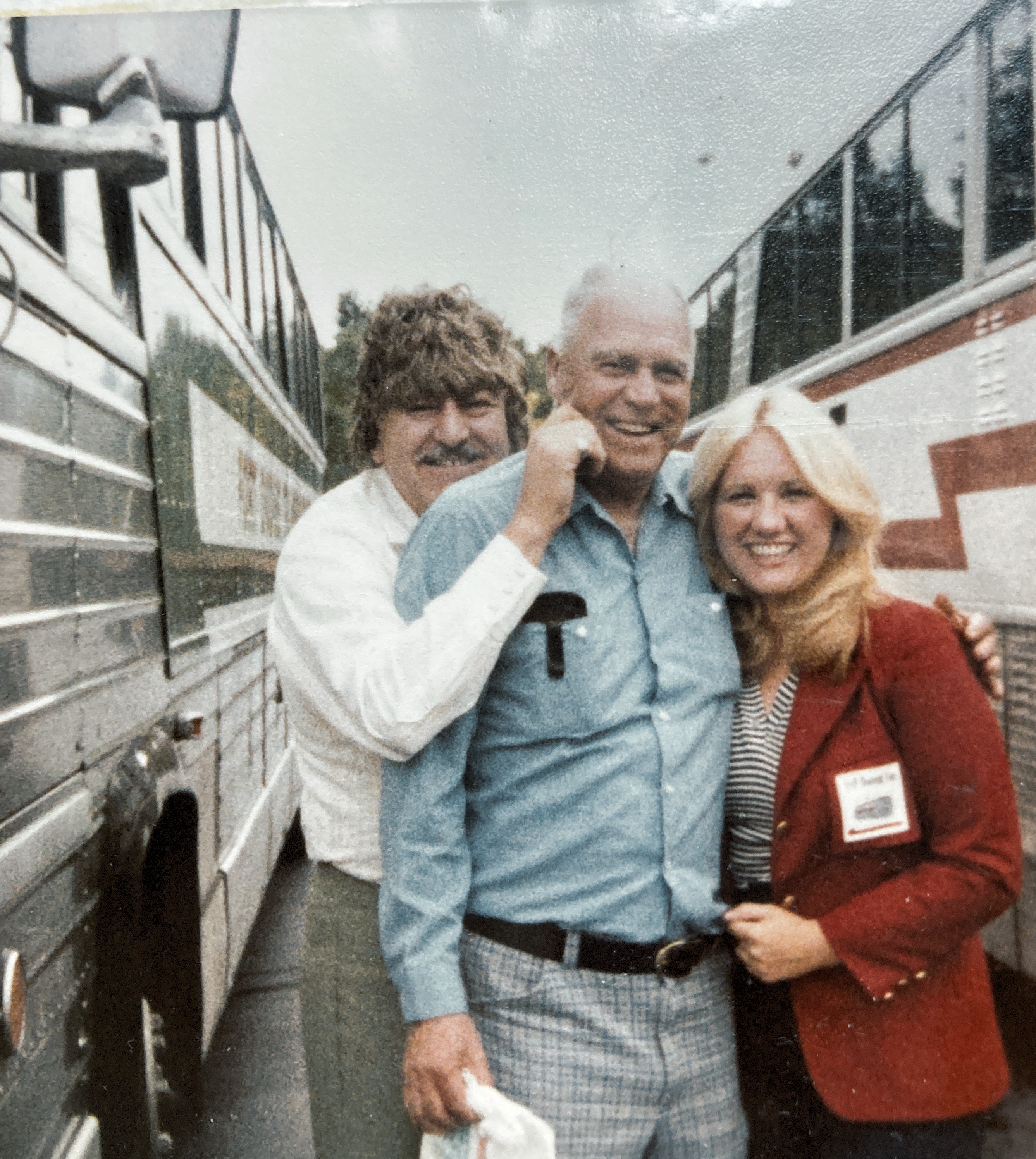 Herald Scofield hamming it up with bus driver and tour guide from a senior citizen trip. 1979.