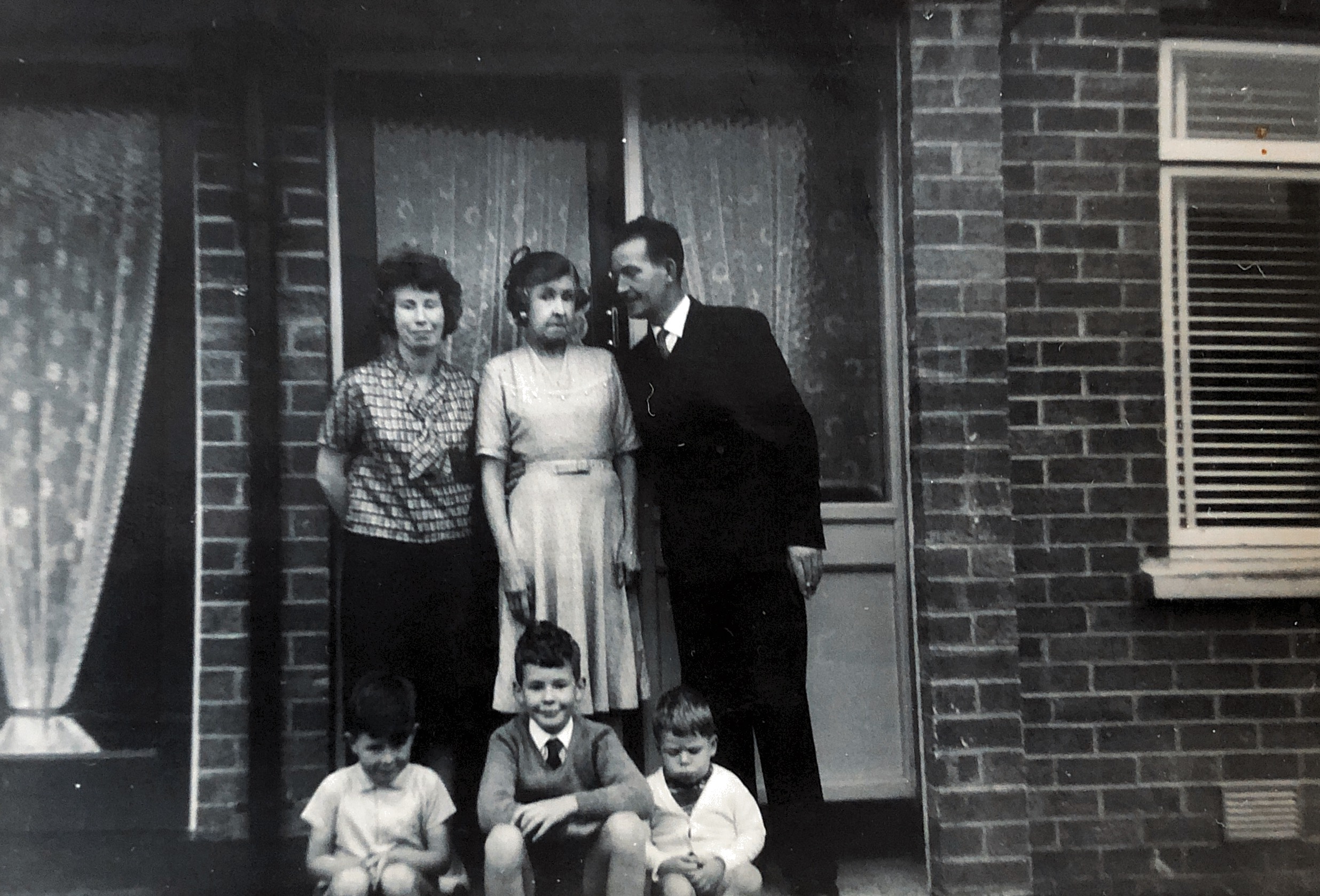 Circa 1961 Belfast, Northern Ireland - At Aunt Theresa Best (Nee Delaney) house with Grandma Delaney (Mary Ann McConville), Thomas Alfred Delaney, ??, James Peter Delaney, Kenneth Delaney.