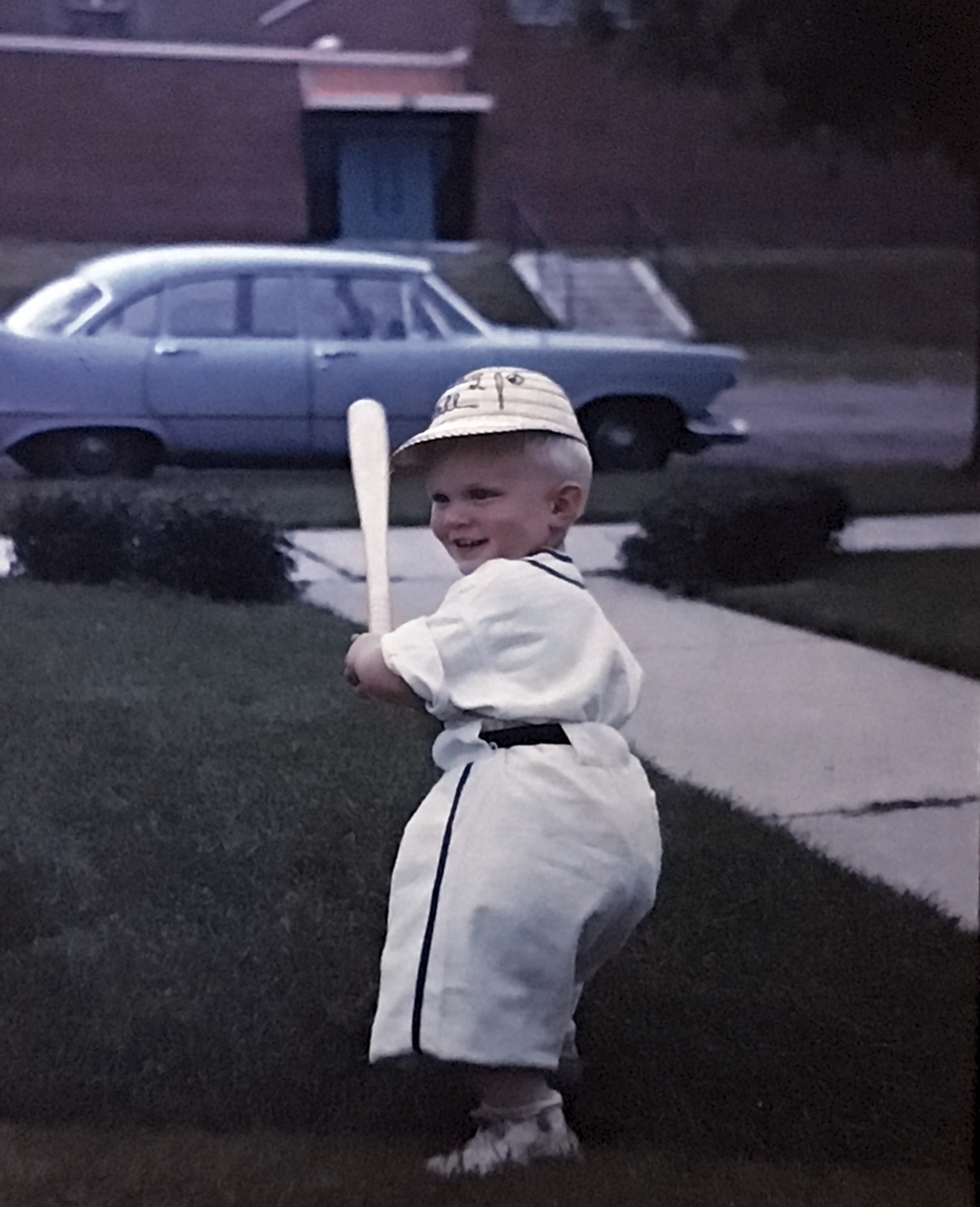 My younger brother in his baseball unform at 18 months old in 1962.