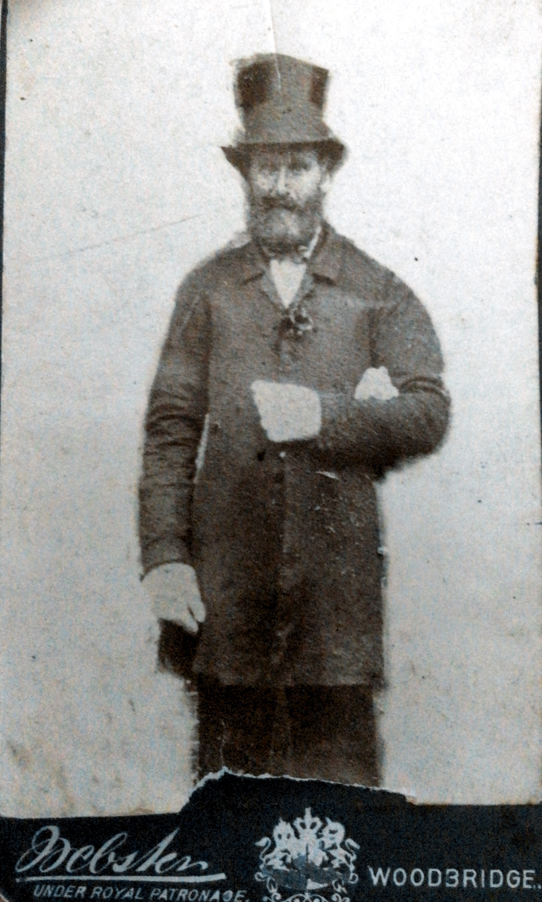 Amos Fisk b 1825. m 12 October 1852. d 20th April 1895. 
Possibly at his daughter’s wedding on 1st October 1878 when he would have been 53 years old. Note the ghostly hand linking his left arm!